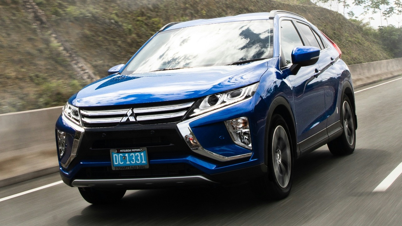 Image Credit: a blue car driving on a road — Russian Supreme