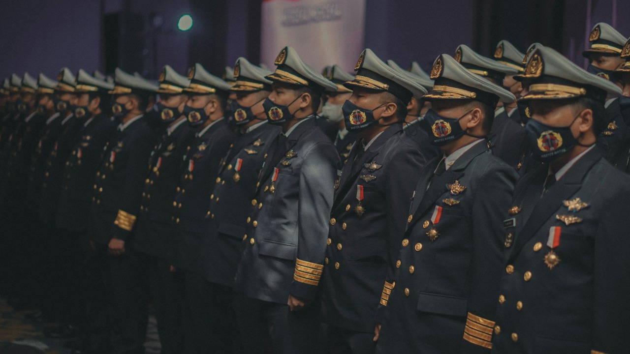 Image Credit: a group of men in military uniforms standing in a row — Peto Tj