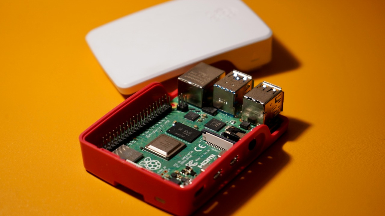 red and white circuit board — Praveen Thirumurugan