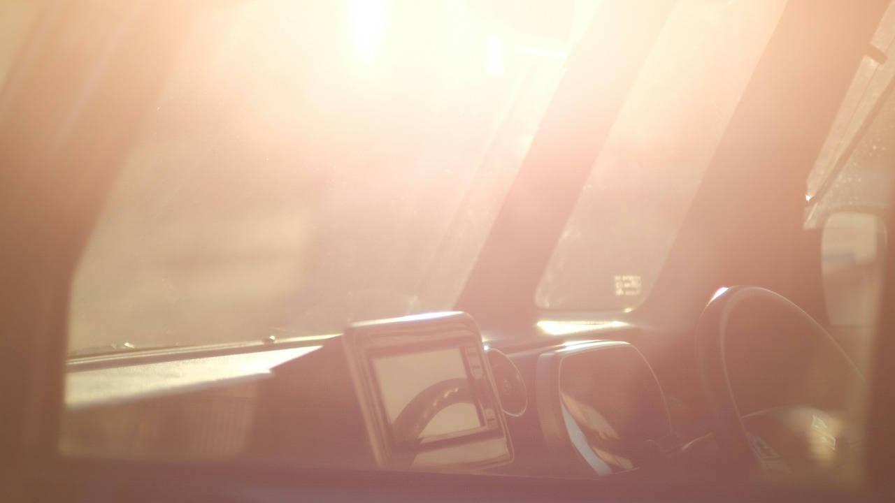 Image Credit: the sun shines brightly through the windshield of a car — Mak