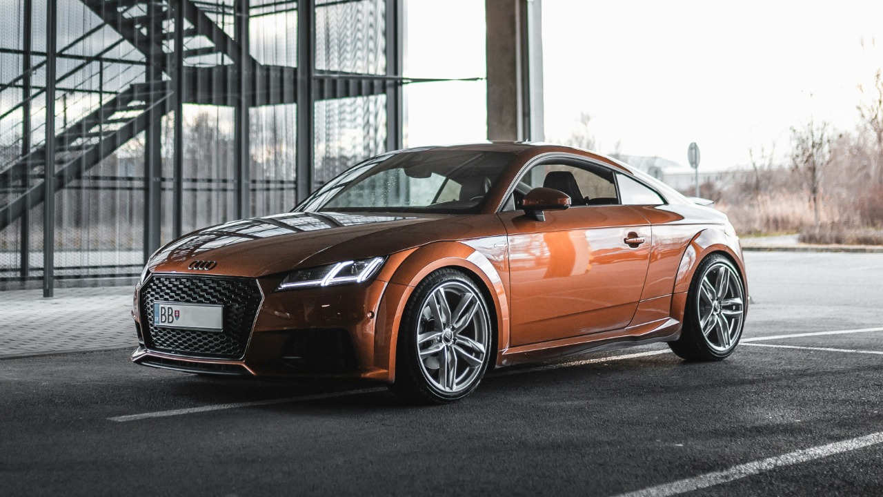 Image Credit: brown Audi TT parked inside lot — Martin Katler
