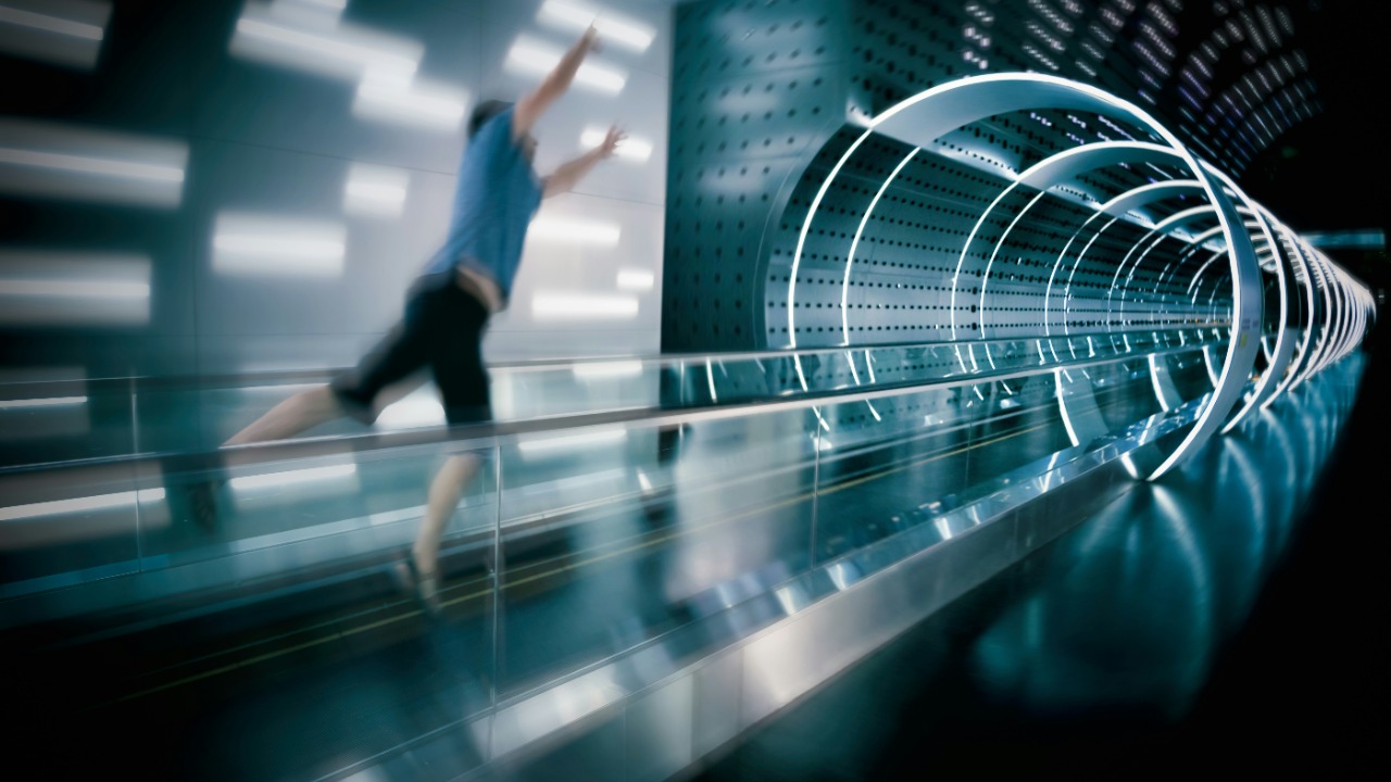 man jumps on escalator — Andy Beales