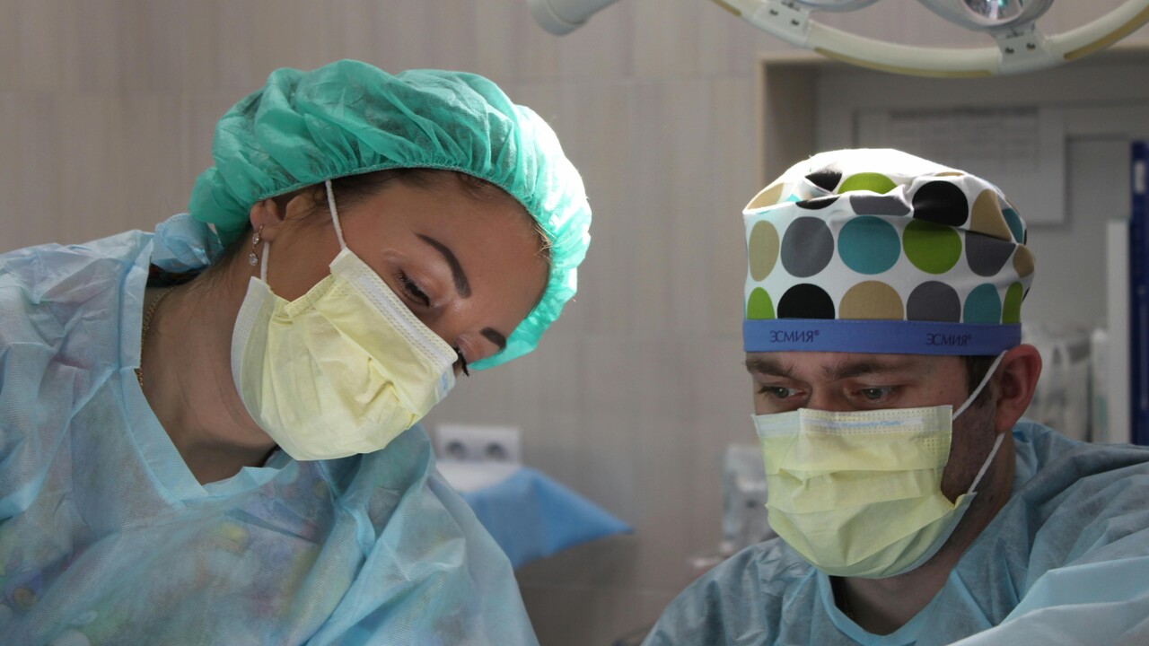 Surgeons performing surgery