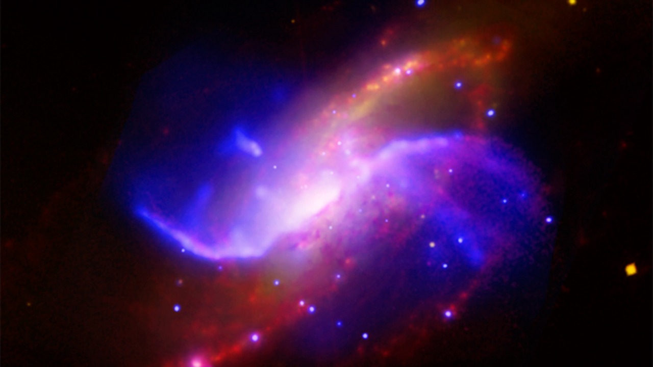 Image Credit: X-ray: NASA/CXC/Univ. of Maryland/A.S. Wilson et al.; Optical: Pal.Obs. DSS; IR: NASA/JPL-Caltech; VLA: NRAO/AUI/NSF - Public domain/Wiki Commons