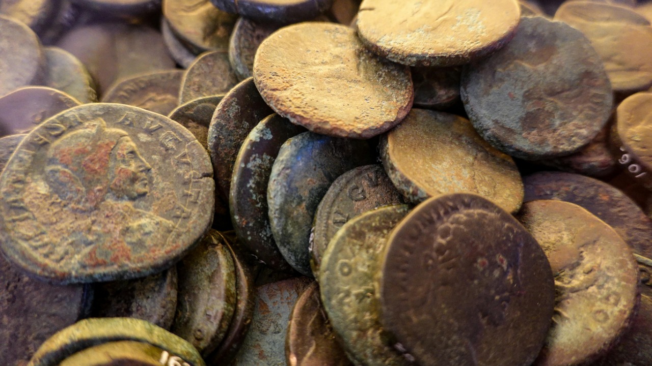 French dig finds jar packed with tens of thousands of Roman coins