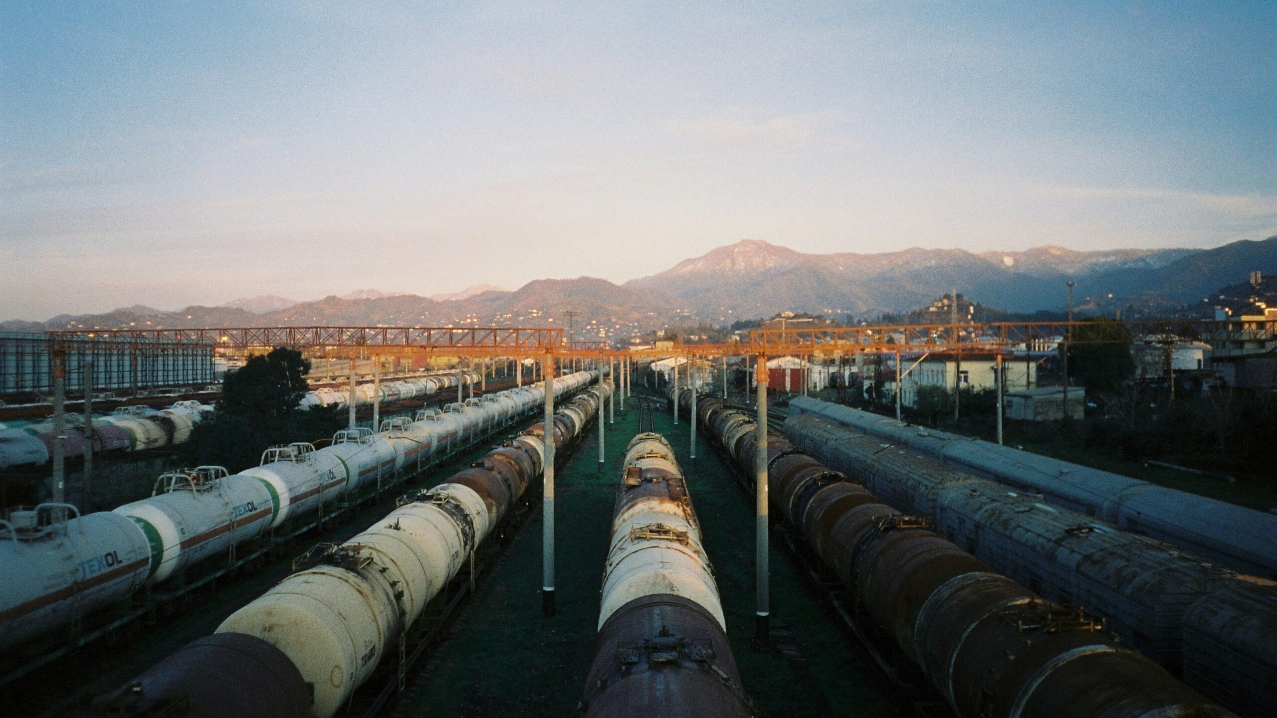 a train yard filled with lots of train cars