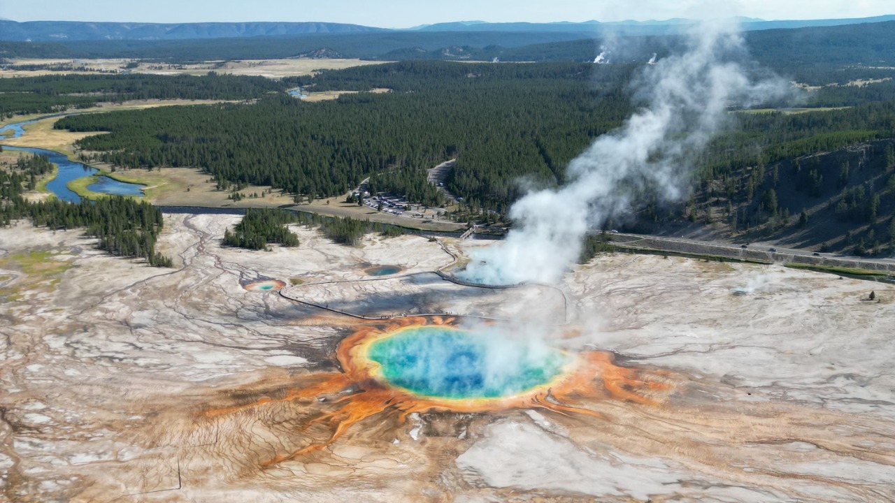 A breathtaking aerial view of Grand Prismatic Spring in Yellowstone National Park, showcasing vibrant colors and geologic features. Vasilis Karkalas/Pexels
