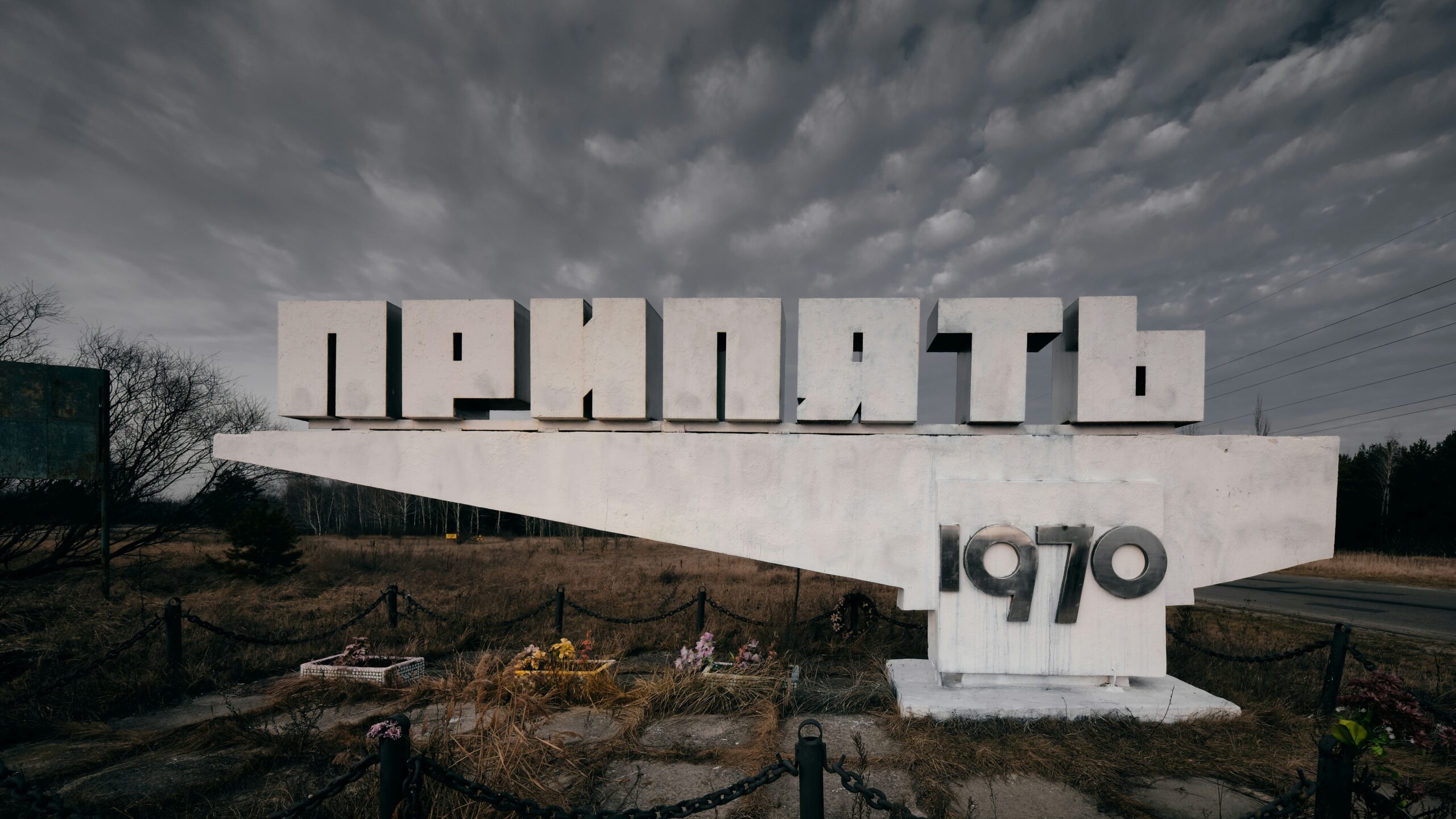 white and black concrete building under gray clouds